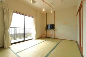 Televisyen dan/atau pusat hiburan di 民宿たかはま Takahama Guest house