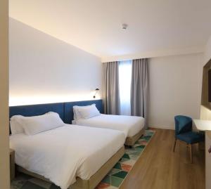 Hampton by Hilton Rome North Fiano Romano客房内的一张或多张床位