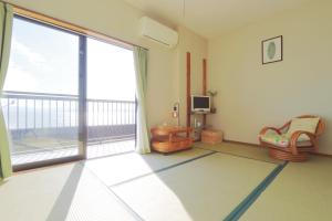 Televisyen dan/atau pusat hiburan di 民宿たかはま Takahama Guest house