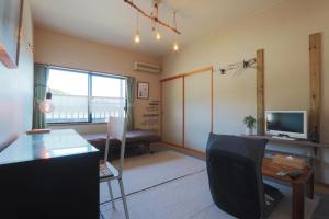 Televisyen dan/atau pusat hiburan di 民宿たかはま Takahama Guest house