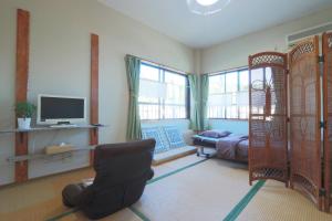 Televisyen dan/atau pusat hiburan di 民宿たかはま Takahama Guest house