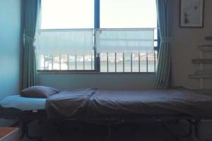 Katil atau katil-katil dalam bilik di 民宿たかはま Takahama Guest house