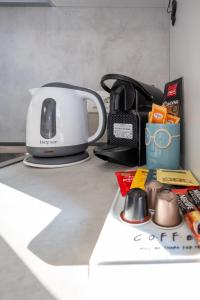 a toaster sitting on top of a kitchen counter at Your Sea Escape in Riva Trigoso +14 photos