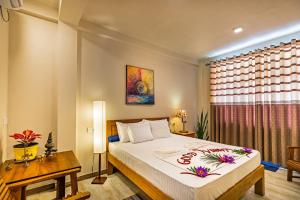 Postel nebo postele na pokoji v ubytování Hiru Hotel + 37 fotografií