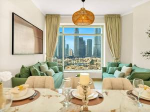 a living room with a view of a city at Royal Vista at Burj Views - Dubai City & Burj Khalifa Views - Brand New Luxury 2BR Apartment in Dubai