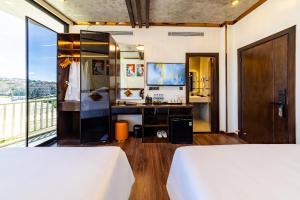 Postel nebo postele na pokoji v ubytování Phuc Hai Hotel Da Lat