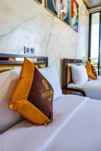 Postel nebo postele na pokoji v ubytování Phuc Hai Hotel Da Lat