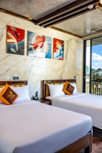 Postel nebo postele na pokoji v ubytování Phuc Hai Hotel Da Lat