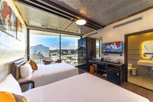 TV a/nebo společenská místnost v ubytování Phuc Hai Hotel Da Lat
