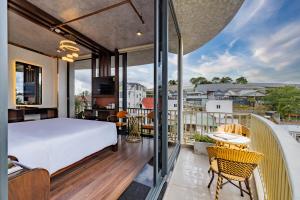 a bedroom with a bed on a balcony at Phuc Hai Hotel Da Lat in Da Lat