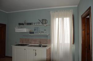 A kitchen or kitchenette at Casale Dolci Dimore
