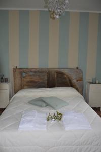 A bed or beds in a room at Casale Dolci Dimore