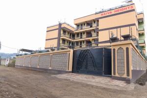 a building with a gate in front of a building at Jay Homes - Naiva Heights in Naivasha