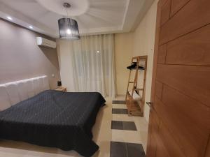 Postel nebo postele na pokoji v ubytování NOUR appartement