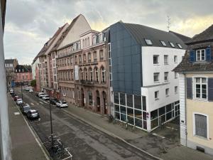 a view of a city street with buildings at Appart 3P 57 m2 Le Coeur de la Krutenau Strasbourg in Strasbourg