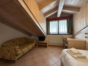 Ένα ή περισσότερα κρεβάτια σε δωμάτιο στο Hotel Garnì Maffei