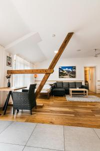 a living room with a couch and a table at Statek Samsara in Blansko