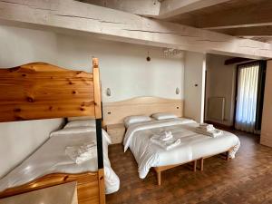 Ένα ή περισσότερα κρεβάτια σε δωμάτιο στο Hotel Garnì Maffei