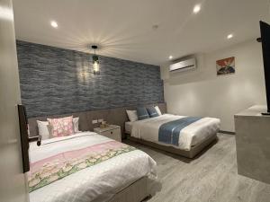 Uma cama ou camas num quarto em 墾丁卿卿文旅
