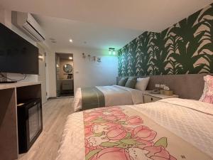 Uma cama ou camas num quarto em 墾丁卿卿文旅