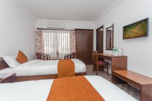 Voodi või voodid majutusasutuse Fuji Hotel toas