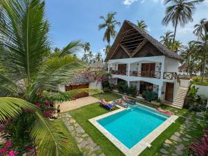 an aerial view of a villa with a swimming pool at Mambo Cabana in Pwani Mchangani