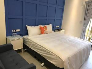 Rúm í herbergi á 宜蘭白鵝田園 l 包棟Villa