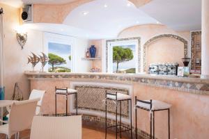 Posezení v ubytování HOTIDAY Room Collection - Baja Sardinia
