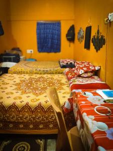 Postel nebo postele na pokoji v ubytování Risabya Guest House