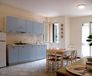 Dapur atau dapur kecil di Residence Loggetta Margherita