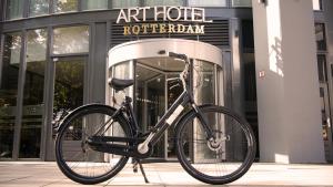 a bike parked in front of a building at ART Hotel Rotterdam-Fully Renovated in Rotterdam