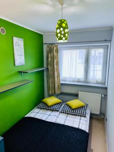 Posteľ alebo postele v izbe v ubytovaní APARTAMENT NAD KAMIEŃCZYKIEM II