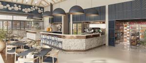 a restaurant with tables and chairs and a counter at Ballito Hills unit 350 in Ballito