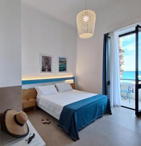 Postel nebo postele na pokoji v ubytování Hotel Miramare