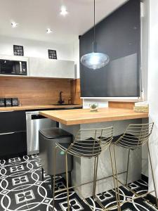 Kuchyň nebo kuchyňský kout v ubytování La Catedral - Más que apartamentos lujo