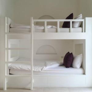 Postel nebo postele na pokoji v ubytování Biệt Thự Trường Hải