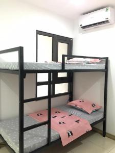 Postel nebo postele na pokoji v ubytování Biệt Thự Trường Hải