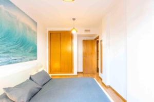 Łóżko lub łóżka w pokoju w obiekcie Altorreal - Más que apartamentos
