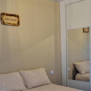 Postel nebo postele na pokoji v ubytování L'hirondelle