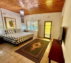 Ένα ή περισσότερα κρεβάτια σε δωμάτιο στο The Seed Pod Guesthouse