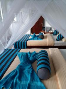 Postel nebo postele na pokoji v ubytování Sunray Homestay