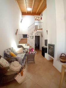 a living room with a couch and a table at Casa Roma in Raposeira
