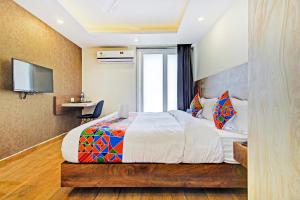 Postel nebo postele na pokoji v ubytování FabHotel Soft Petals