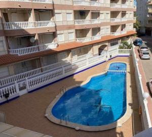 Bazén v ubytování Acogedor apartamento a 200 m de la playa nebo v jeho okolí