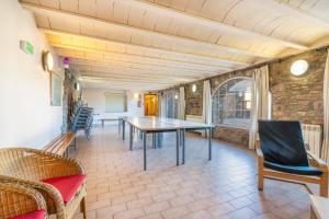 a dining room with a table and chairs at Rectoria de Claverol in Claverol