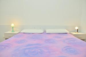 A bed or beds in a room at Condominio Sovego