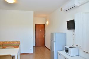 A kitchen or kitchenette at Condominio Sovego