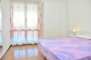 A bed or beds in a room at Condominio Sovego