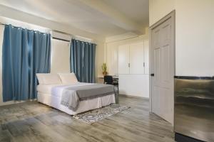 A bed or beds in a room at Bel Rev Studio