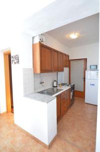 Kuchyň nebo kuchyňský kout v ubytování Apartments Marija